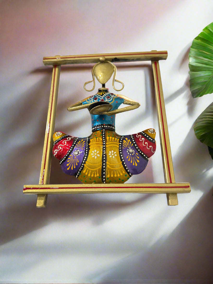 Decorative wall art of a dancer in a colorful outfit with a gold frame on a white background